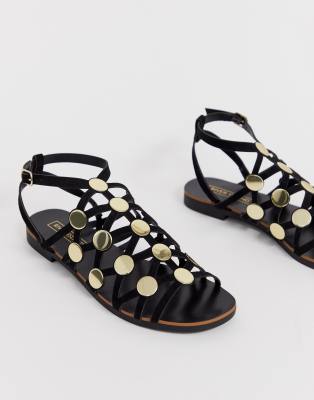 black caged flat sandals