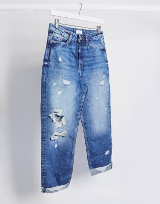 mid blue ripped mom tapered jeans