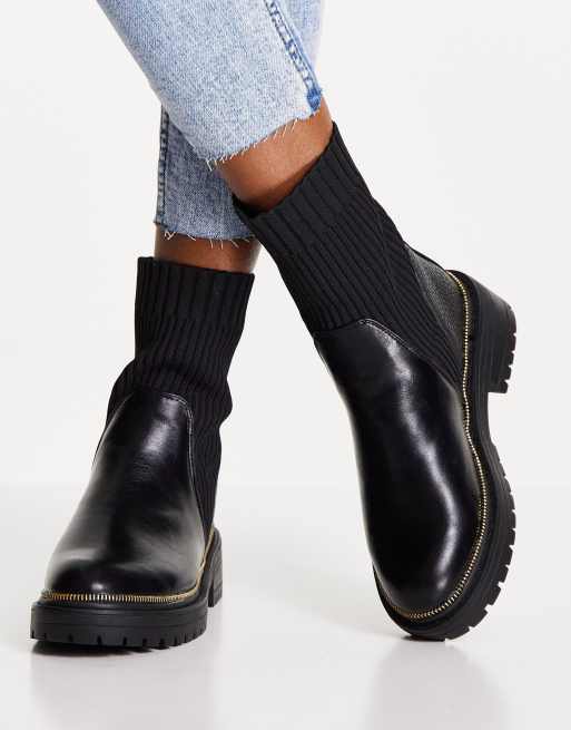 River Island chunky cleated sole heeled sock boot in black ASOS