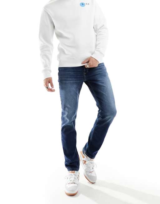 River Island – Ciemnoniebieskie dopasowane jeansy