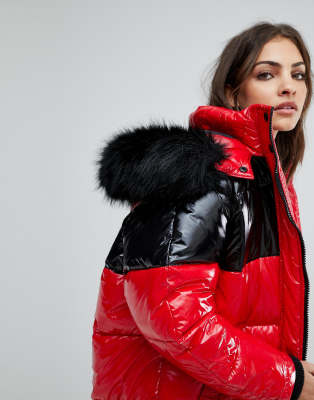 red puffer jacket with black fur hood