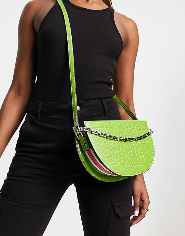 River Island - croc saddle bag with chain and pink piping detail in green