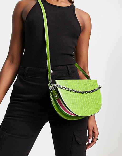 River Island croc saddle bag with chain and pink piping detail in green ...