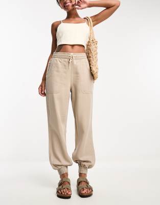 River Island cuffed cargo jogger in beige | ASOS