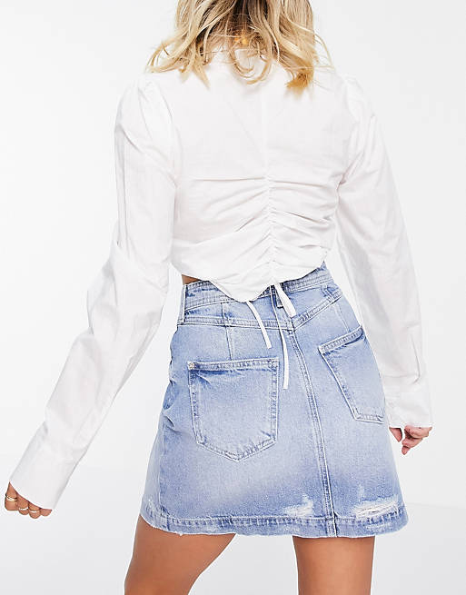 Women River Island denim mini skirt with stepped waistband in mid blue 