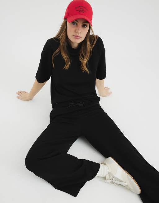 River Island - Effen joggingbroek met wijde pijpen in zwart