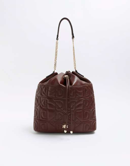 River Island Embossed drawstring shoulder bag in brown dark