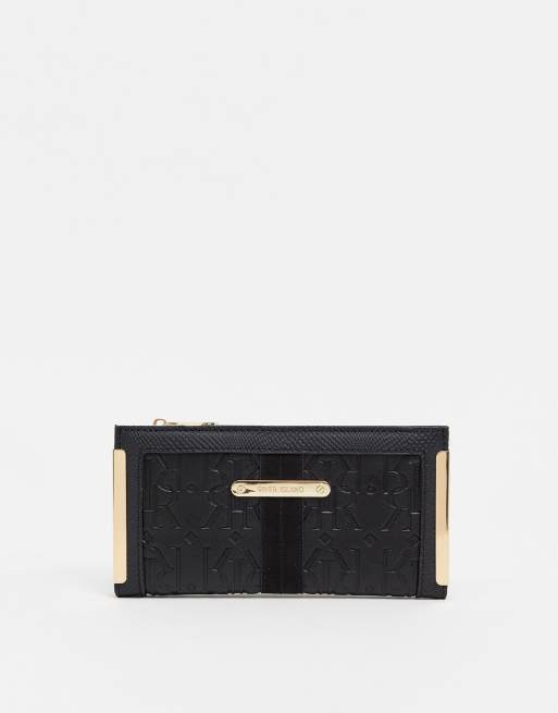 River Island embossed monogram mini zip wallet in black