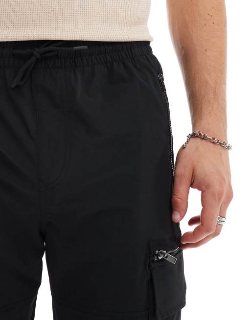 River Island – Eng geschnittene Cargohose in Schwarz, 2 von 5