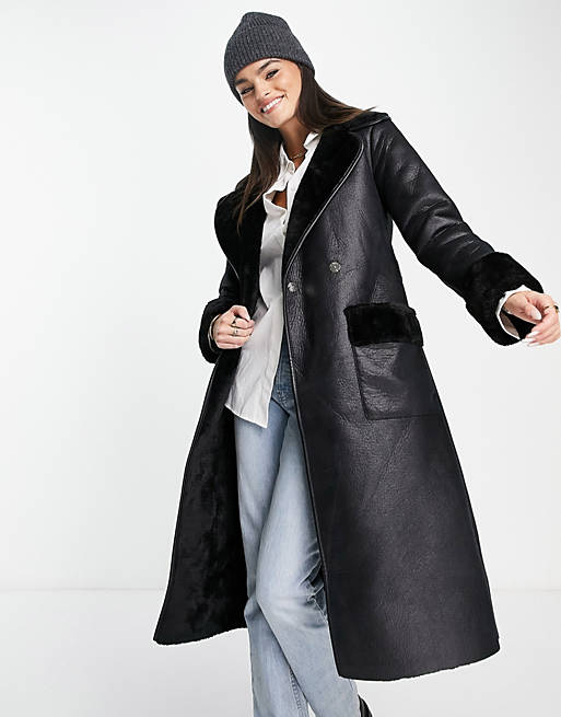 River Island faux shearling belted coat in black | ASOS