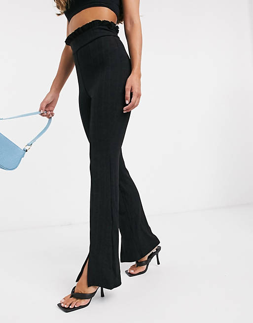  River Island frill waist ribbed flared trousers in black 