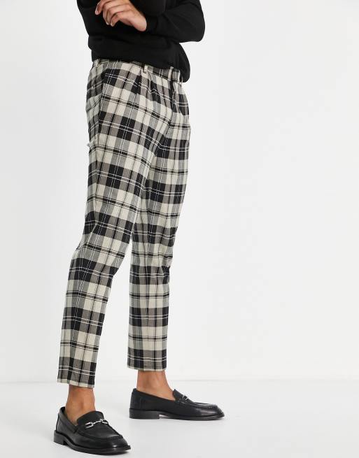 River Island - Geplooide geruite broek met toelopende pasvorm in ecru 