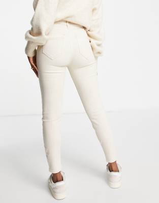cream skinny jeans