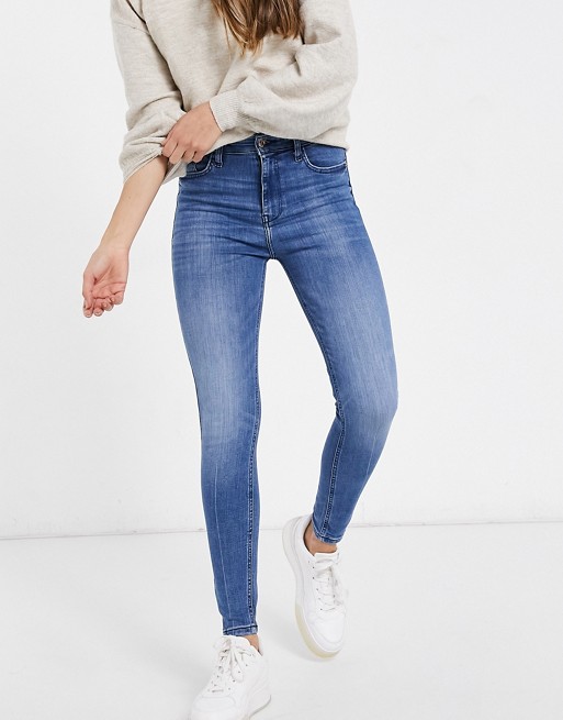 River Island high rise skinny jeans in mid blue