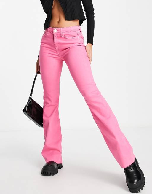 River Island – Jaskraworóżowe jeansowe dzwony ze średnim stanem i nieobszytym brzegiem