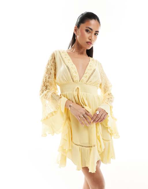 River Island – Jasnożółta sukienka mini z falbankami i rozkloszowanymi rękawami