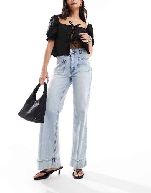 River Island - Jeans met wijde pijpen en zakdetail in lichte wassing blauw