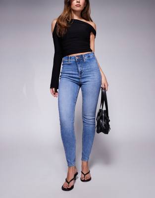 River Island - Jeans mit enger Schnitt und hohem Bund in mittelblauer Waschung