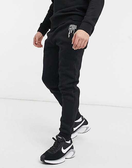 River Island jersey joggers with print in black | ASOS