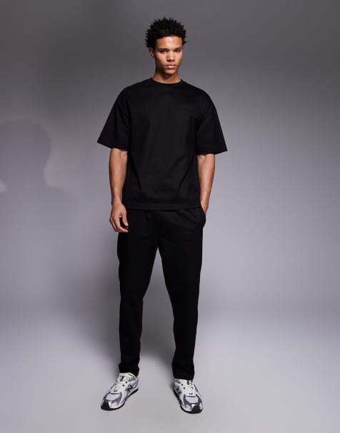 River Island – Jersey-Set in Schwarz, bestehend aus Jogginghose und T-Shirt - view 1