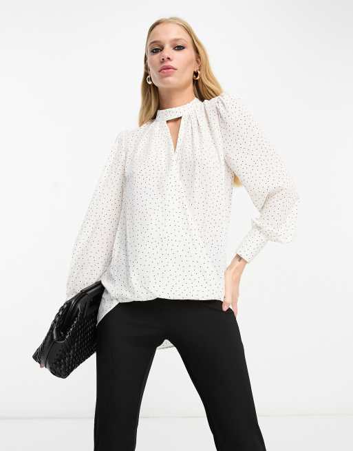 White blouse store with black spots