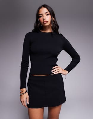 River Island - Langärmliges, figurbetontes Strickoberteil in Schwarz