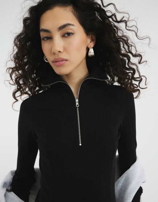River Island long sleeve zip front ribbed top in black ASOS