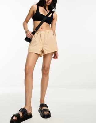 River Island low rise parachute shorts in beige | ASOS