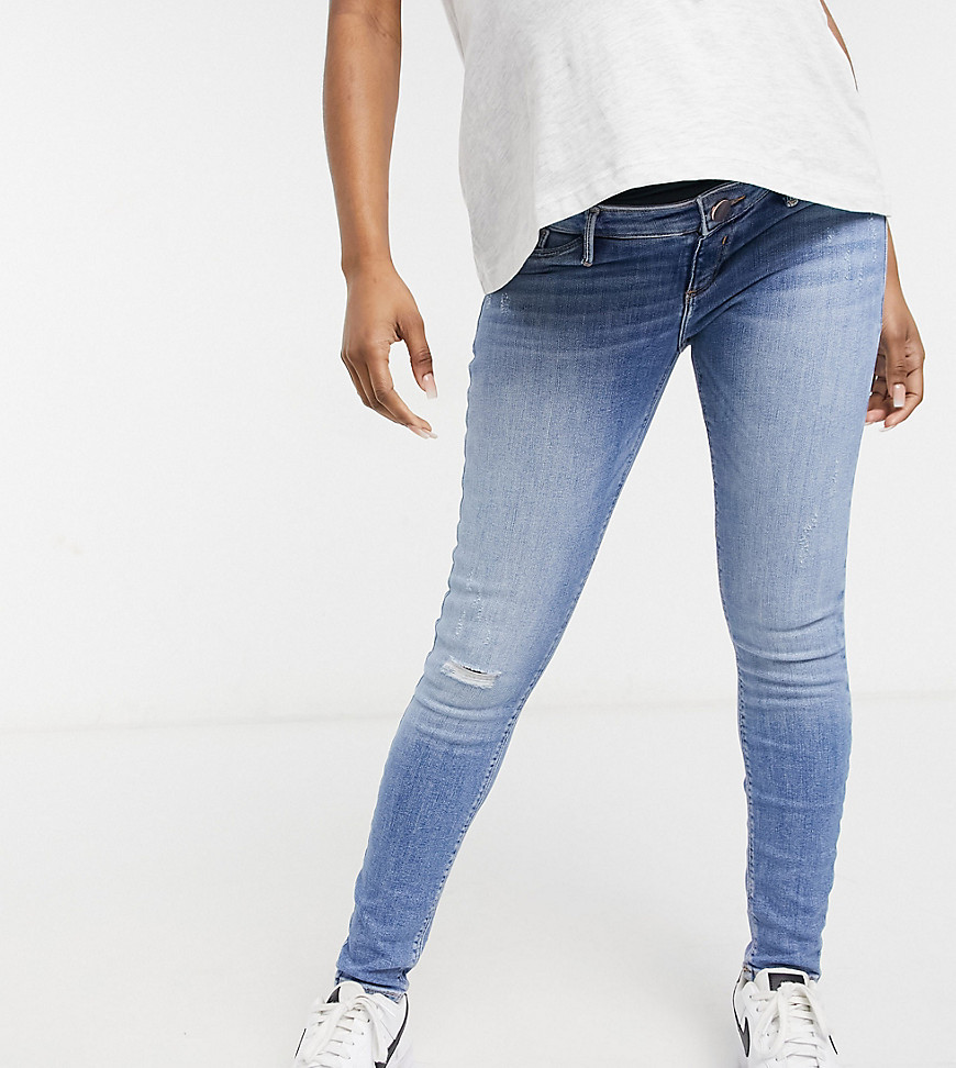 River Island – Mammakläder – Molly – Ljusblå skinny jeans med midjeband över magen
