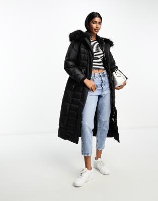 River Island - Maxi-Steppmantel in Schwarz mit Gürtel und Kapuze mit Kunstpelzbesatz