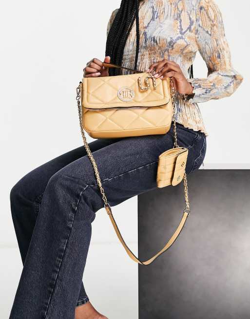 River Island medium quilted cross body bag in beige ASOS