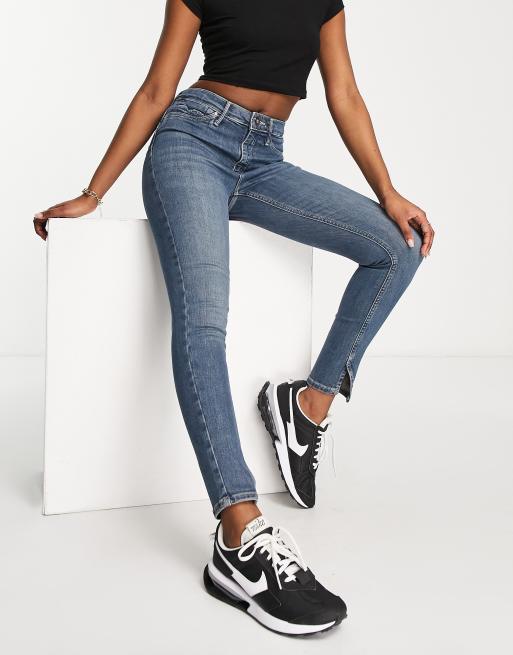 River Island – Mellanblå, skulpterande skinny jeans med medelhög midja