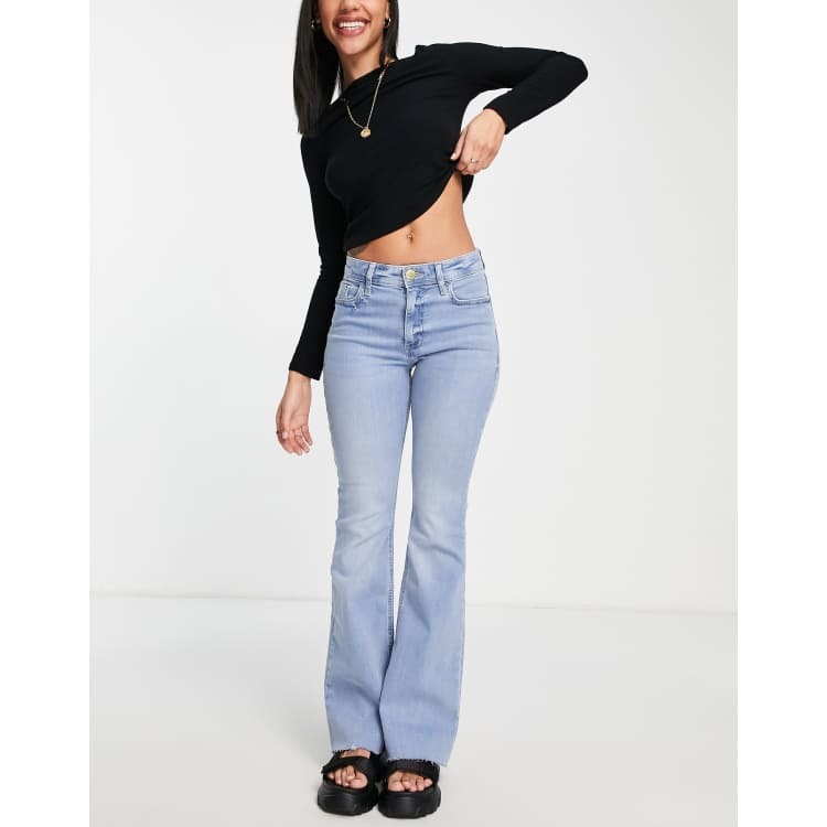 ASOS DESIGN Mid rise flare jeans in light wash blue