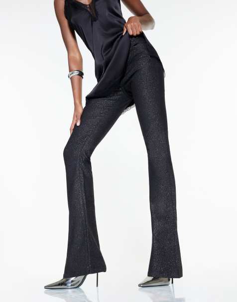 River Island Mid rise glitter flared jeans in black - view 1