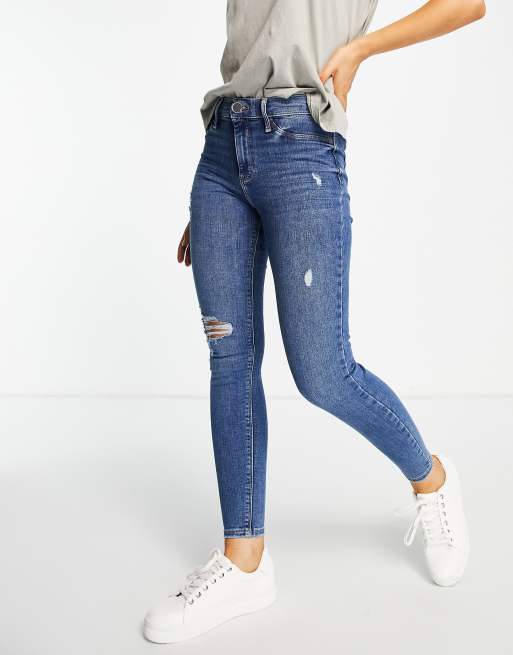 River Island Mid Rise Ripped Skinny Jeans In Dark Blue Asos