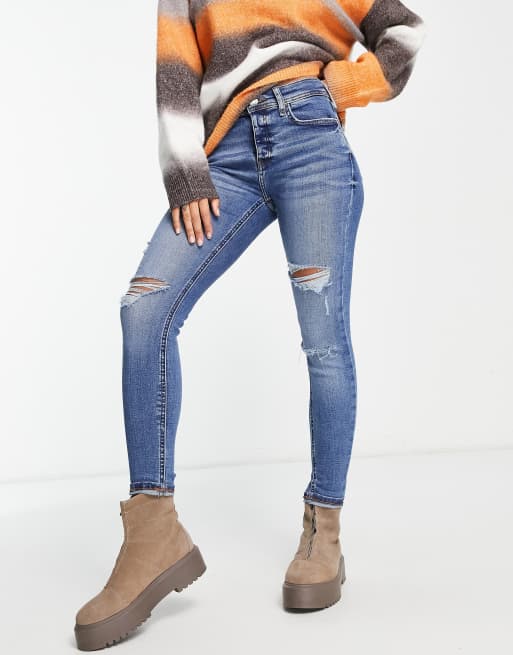 River Island mid rise skinny jean with rips in dark blue