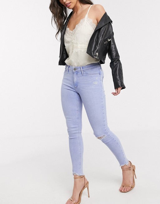 River Island Molly destroyed hem skinny jeans in buzzy blue