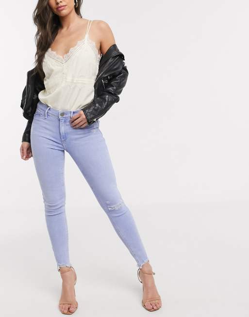 Destroyed hem hot sale skinny jeans