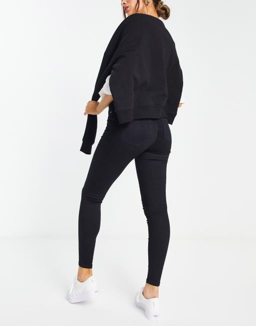 River Island – Molly – Eng geschnittene, figurformende Jeans in Schwarz mit mittelhohem Bund, 3 von 5