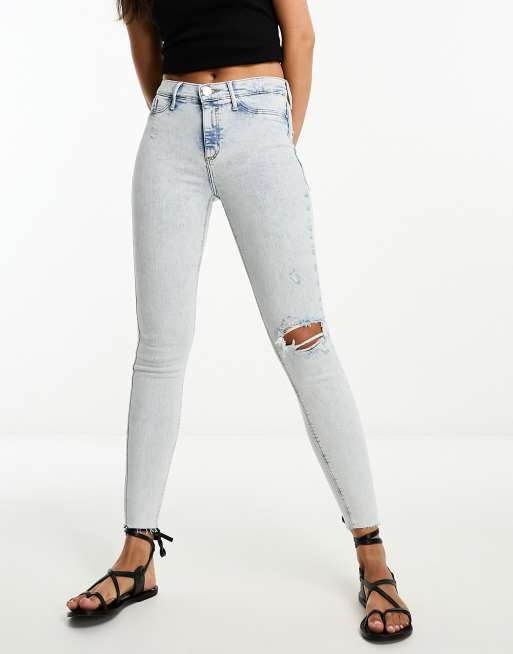 Ripped mid best sale rise jeans