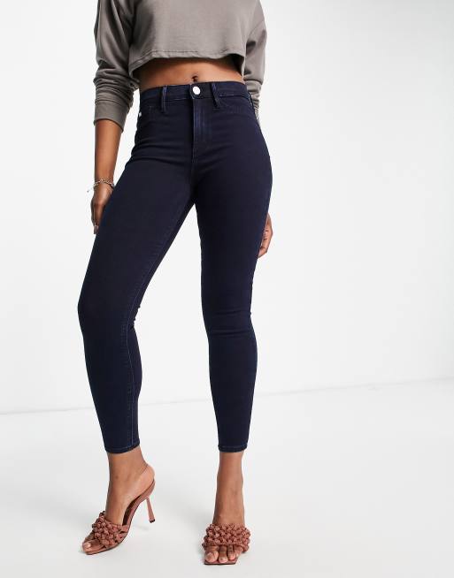 River Island Molly mid rise skinny jeans in dark blue | ASOS