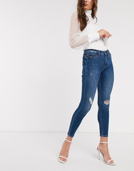 River Island Molly ripped detail skinny jeans in mid blue