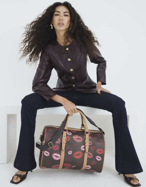River Island Monogram lip print holdall bag in brown - dark - view 1