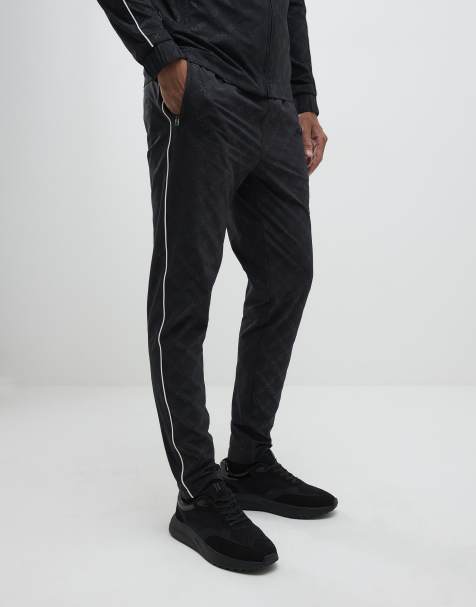 River Island Monogram piped joggers in black - view 1