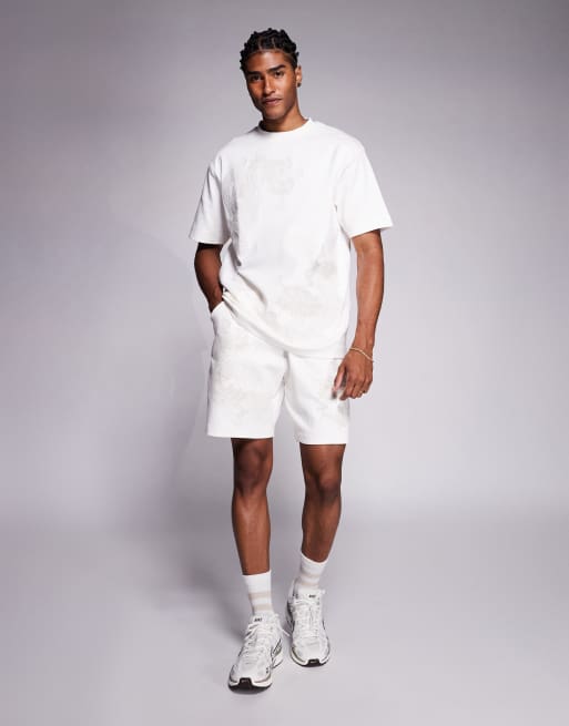 River Island – Naturvita shorts med broderad drake, del av set