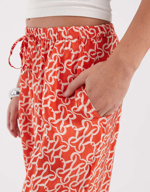 River Island – Orange byxor med monogrammönster , 4 av 5