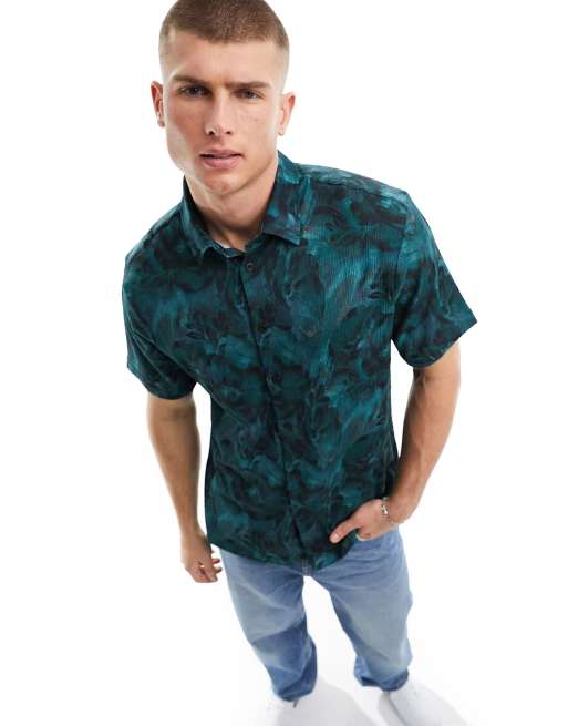 River Island - Overhemd van kreukelstof met korte mouwen en bloemenprint in donker groenblauw