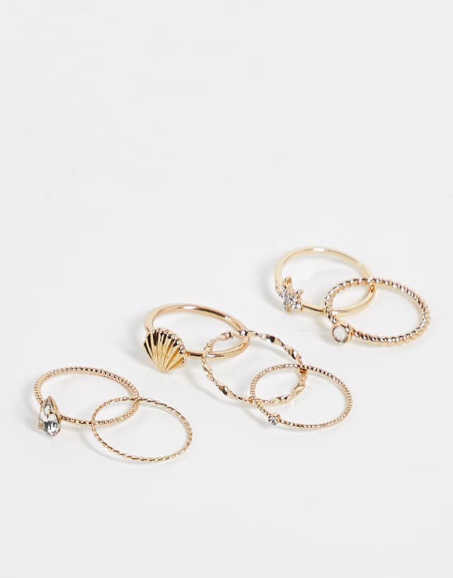 River Island pack of 7 rings with shell design in gold tone