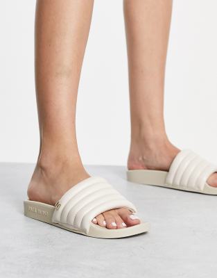 River Island padded ribbed sliders in cream | ASOS