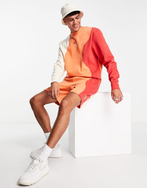 River Island - Pantaloncini arancioni sfumati a onde